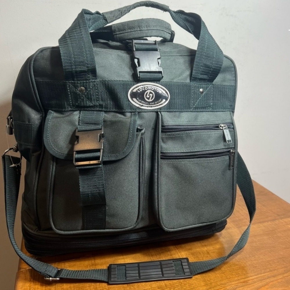 Vintage Locomotor expandable carry on luggage with wheels.